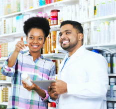 pharmacist assisting young woman