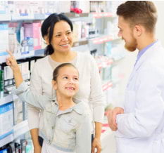 pharmacist assiting his customer